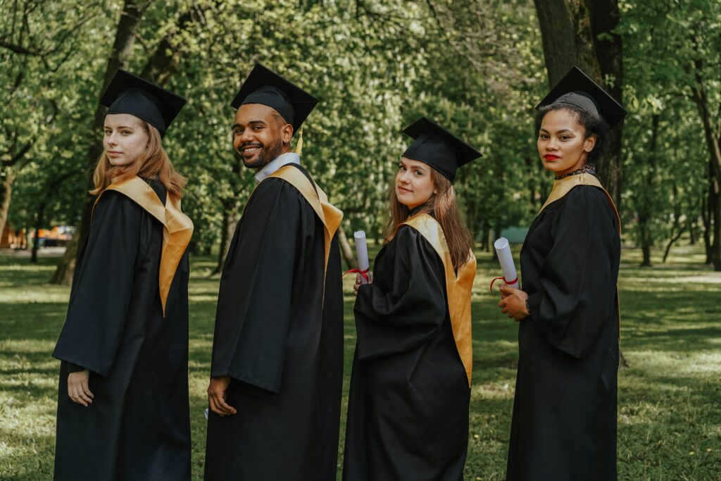 People wearing their graduation gowns.